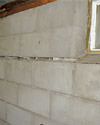 Severely buckling foundation walls in a home in Highland Acres in need of repairs.