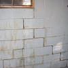 A cracked foundation wall near a window in a Greenville  home