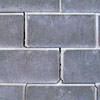 A diagonal stair-step crack found along a foundation wall in a Highland Acres home