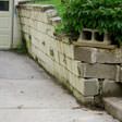 a collapsing retaining wall in Bear