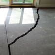 a huge crack in a concrete slab floor in Dover