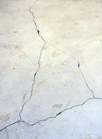 severely cracked, heaving slab floors in a home in Middletown