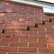 stair step cracking on a foundation wall in New Castle
