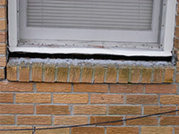 A window sill cracking and separating from the foundation wall in a Lewes home.
