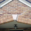 Major tuckpointing on a home archway over a door, with tuckpointing several inches wide that has failed on a Wilmington home