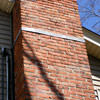 A tilting chimney on a Riverview  home with a leaning, tilting chimney that was temporarily repaired.