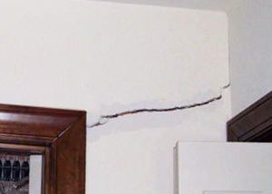 A large drywall crack in an interior wall in Pike Creek