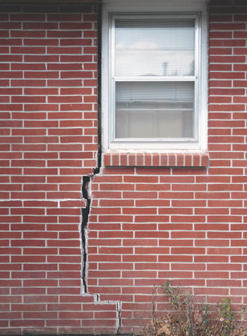 severe foundation wall cracks along a window in Wilmington