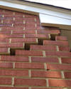 Serious damage to a foundation wall due to settlement of a home in Harrington